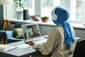 back view young muslim female student online lesson back view young muslim female student headphones hijab 262022952